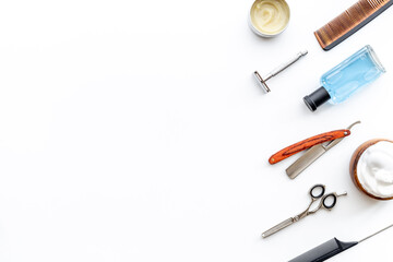 Set of shaving tools with barber razor and foam in wooden bowl