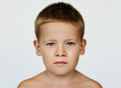 Portrait of a young kid with a serious expression