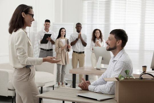 Boss Introducing New Employee To Coworkers In Office