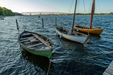 Denmark, Middelfart, 04-09-2021- Old and new wooden dinghies, are moored