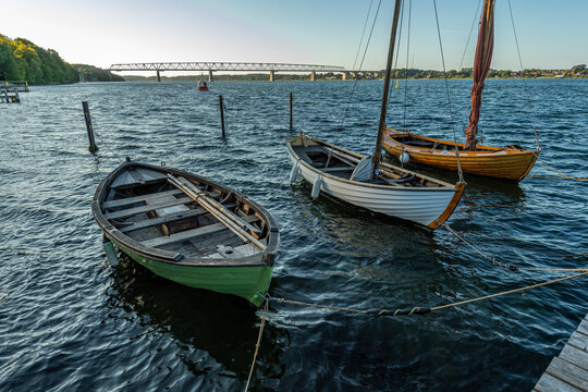Denmark, Middelfart, 04-09-2021- Old and new wooden dinghies, are moored