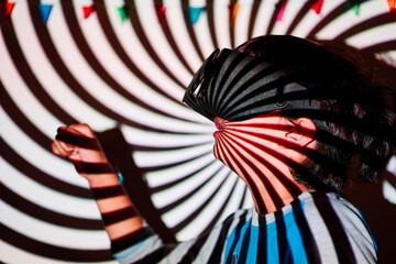boy with augmented reality glasses on a spiral background