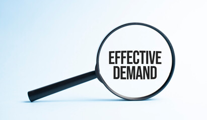 Magnifying glass with the word effective demand. Business concept