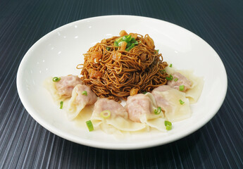 stir fried dry wanton noodle mee with meat dumpling on dark grey wood background dim sum halal menu   