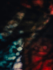 Fototapeta premium Abstract geometry of blue, red, and black shadows in the forest