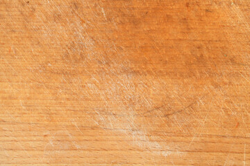Scratched cutting board texture.Brown scratched wooden cutting board. Wood texture.Kitchen concept.