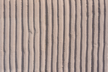 Old wall-  destroyed plaster. Grainy background- cracks, chips, peeling paint