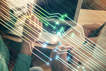 Double exposure of man and woman working together and technology theme drawing hologram. Big data concept. Computer background.