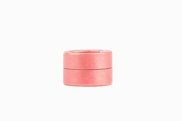 Pink round gift box isolated on white background.