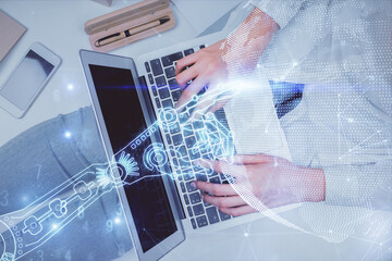 Double exposure of woman hands working on computer and tech theme hologram drawing. Top View. Technology concept.