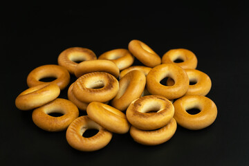 Round yellow bagels on a uniform background for vegetarian food