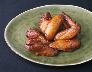 bbq grilled honey golden chicken wing on dark grey wood background fast food halal menu