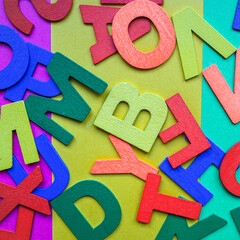 colorful wooden letters, multicolored background