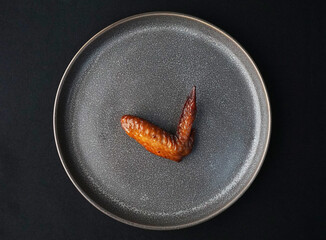 bbq grilled honey golden chicken wing on dark grey wood background fast food halal menu