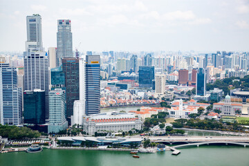 Fototapeta na wymiar SINGAPORE, SINGAPORE - MARCH 2019: aerial view over Singapore downtown with skyscrapers