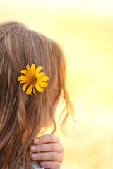 Naklejka premium beautiful girl with a flower in her hair