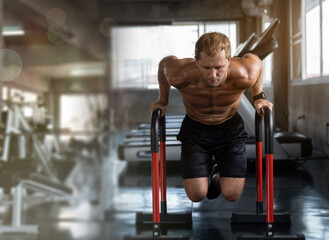Fototapeta premium Muscular Fitness man in the gym, training hard, Athlete makes exercise, Bodybuilder, Sport fitness and muscles concept