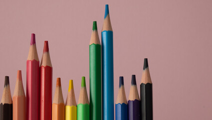 colored pencils aligned horizontally