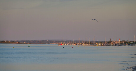 Distant view of the Huelva town of El Rompido at sunrise