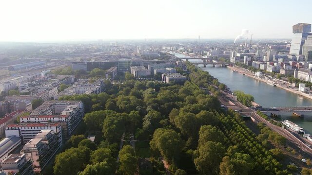 Paris: Aerial view of capital city of France, park Bercy (Parc de Bercy) and river Seine at sunrise - landscape panorama of Europe from above