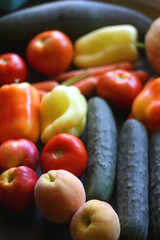 Various colorful summer fruit and vegetable on dark background. Selective focus.