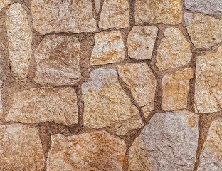rough stone wall closeup, seamless natural background