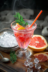 Cocktail in a glass with fruit on an old background.
