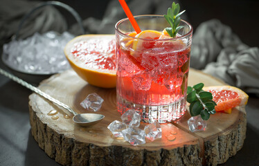 Refreshing summer alcoholic cocktail with crushed ice and citrus fruits