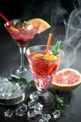 Refreshing summer alcoholic cocktail with crushed ice and citrus fruits