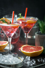 Refreshing summer alcoholic cocktail with crushed ice and citrus fruits