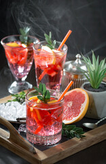 Glasses of wine on a black background.