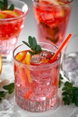 Refreshing summer alcoholic cocktail with crushed ice and citrus fruits