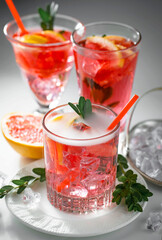 Refreshing summer alcoholic cocktail with crushed ice and citrus fruits