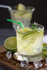 Cocktail in a glass with fruit on an old background.