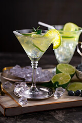 Cocktail in a glass with fruit on an old background.