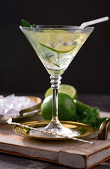 Fruit cocktail, in a glass with natural healthy fruits on a table with kitchen accessories.