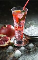 Fruit cocktail, in a glass with natural healthy fruits on a table with kitchen accessories.
