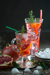 Fruit cocktail, in a glass with natural healthy fruits on a table with kitchen accessories.