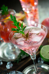 Fruit cocktail, in a glass with natural healthy fruits on a table with kitchen accessories.