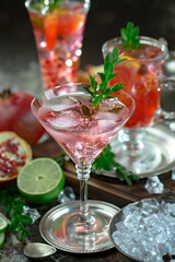 Fruit cocktail, in a glass with natural healthy fruits on a table with kitchen accessories.