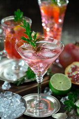 Cocktail in a glass with fruit on an old background.