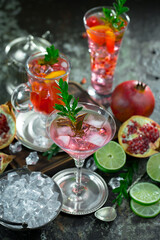 Fruit cocktail, in a glass with natural healthy fruits on a table with kitchen accessories.
