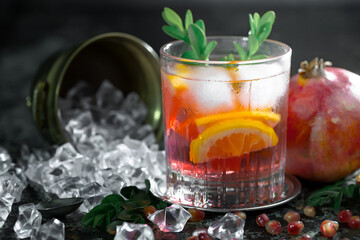 Fruit cocktail, in a glass with natural healthy fruits on a table with kitchen accessories.