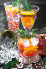 Cocktail in a glass with fruit on an old background.