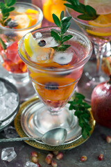 Refreshing summer alcoholic cocktail with crushed ice and citrus fruits