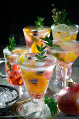 Refreshing summer alcoholic cocktail with crushed ice and citrus fruits