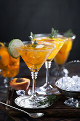 Cocktail in a glass with fruit on an old background.