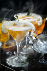 Cocktail in a glass with fruit on an old background.