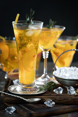 Fruit cocktail, in a glass with natural healthy fruits on a table with kitchen accessories.