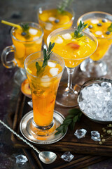 Fruit cocktail, in a glass with natural healthy fruits on a table with kitchen accessories.